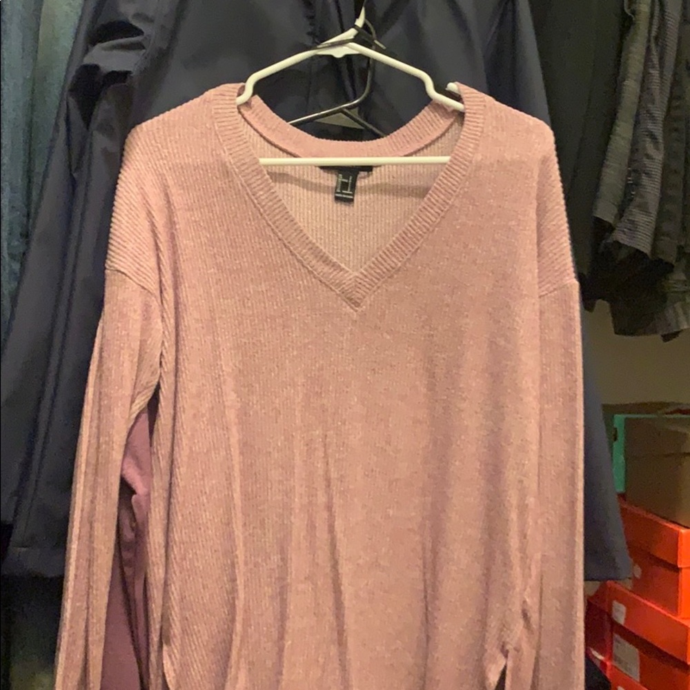 Shirt, almost like a sweater but lighter.
